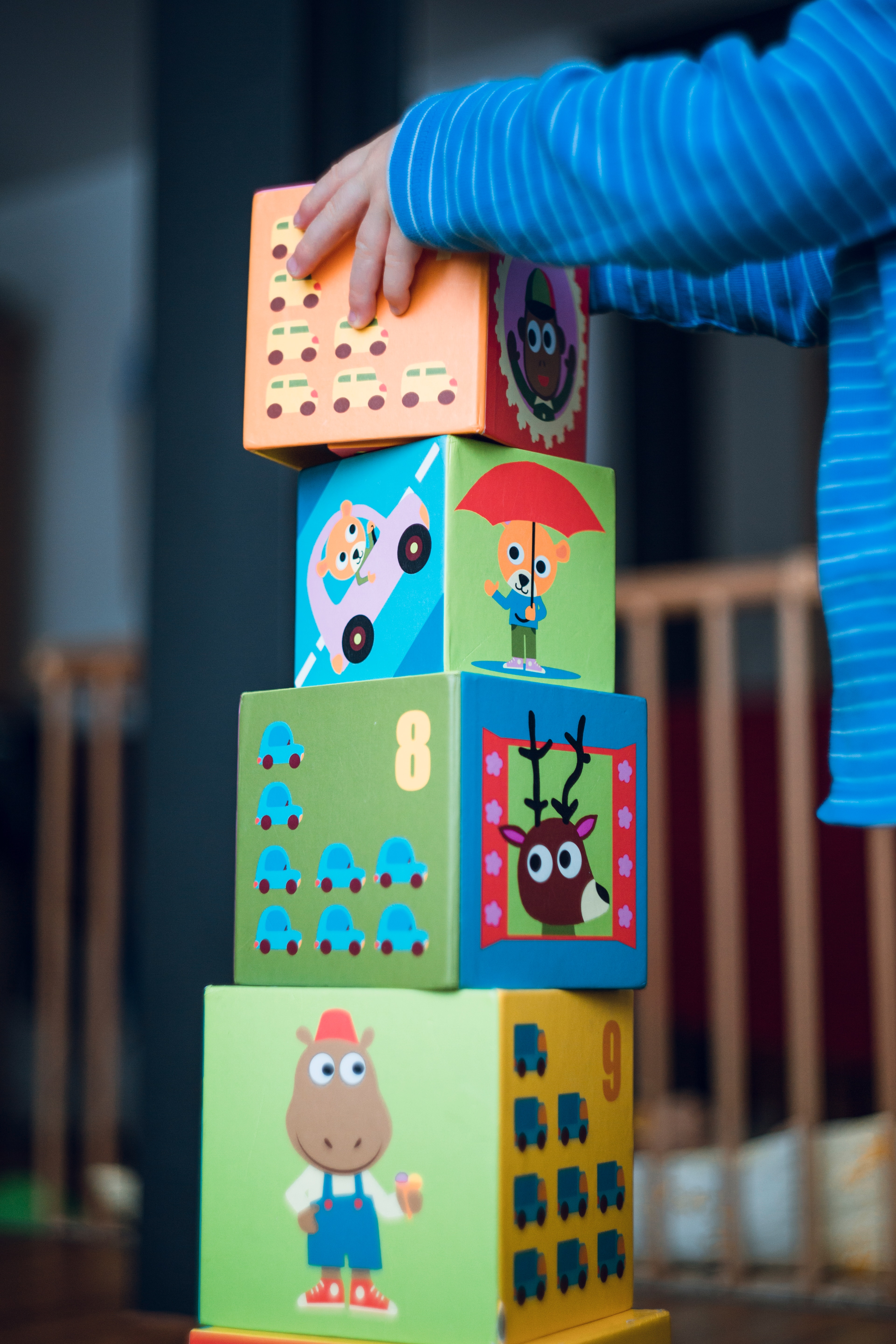 A child stacking block as part of JASPER ABA Therapy